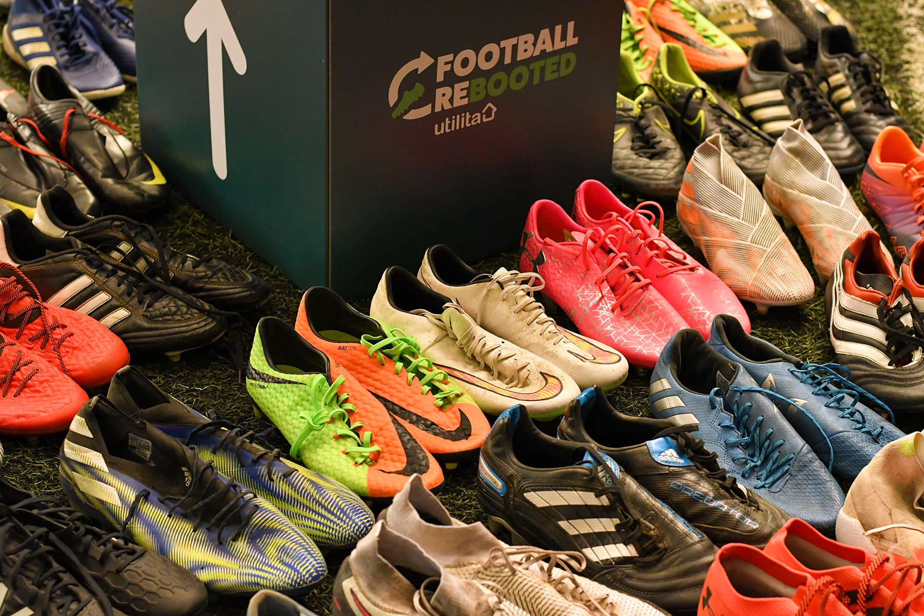 Football Rebooted boot donations next to Football Rebooted bin